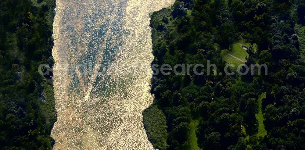 Bredereiche from above - Riparian zones on the course of the river with motorboat in Bredereiche in the state Brandenburg by sunset