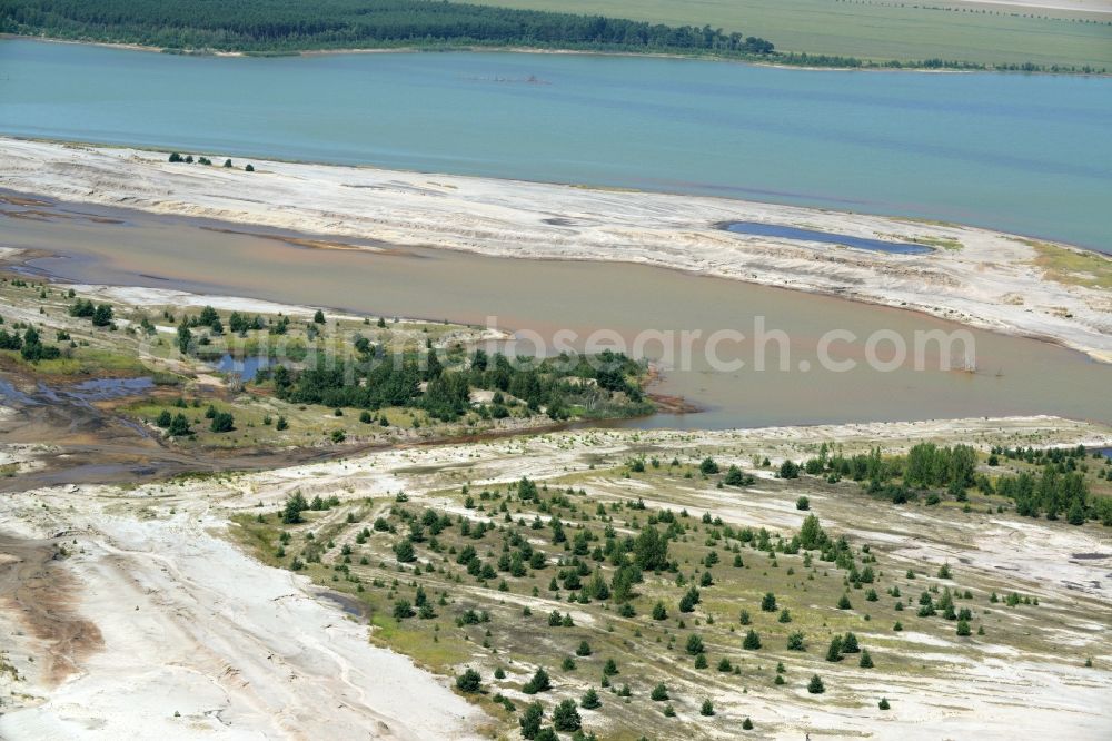 Luckau from above - Shore areas of flooded former lignite opencast mine and renaturation lake Schlabendorfer See in Luckau in the state Brandenburg