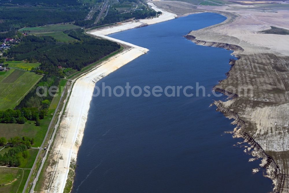 Teichland from the bird's eye view: Shore areas of flooded former lignite opencast mine and renaturation lake Cottbuser Ostsee in Teichland in the state Brandenburg, Germany