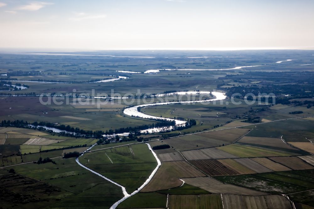 Stapel from the bird's eye view: Shore areas with agricultural land on the Eider - course of the river in Stapel in the state Schleswig-Holstein, Germany