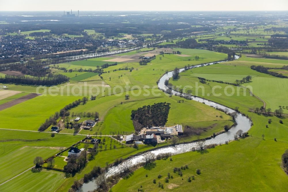 Hünxe from the bird's eye view: Curved loop of the riparian zones on the course of the river Lippe in Huenxe in the state North Rhine-Westphalia, Germany