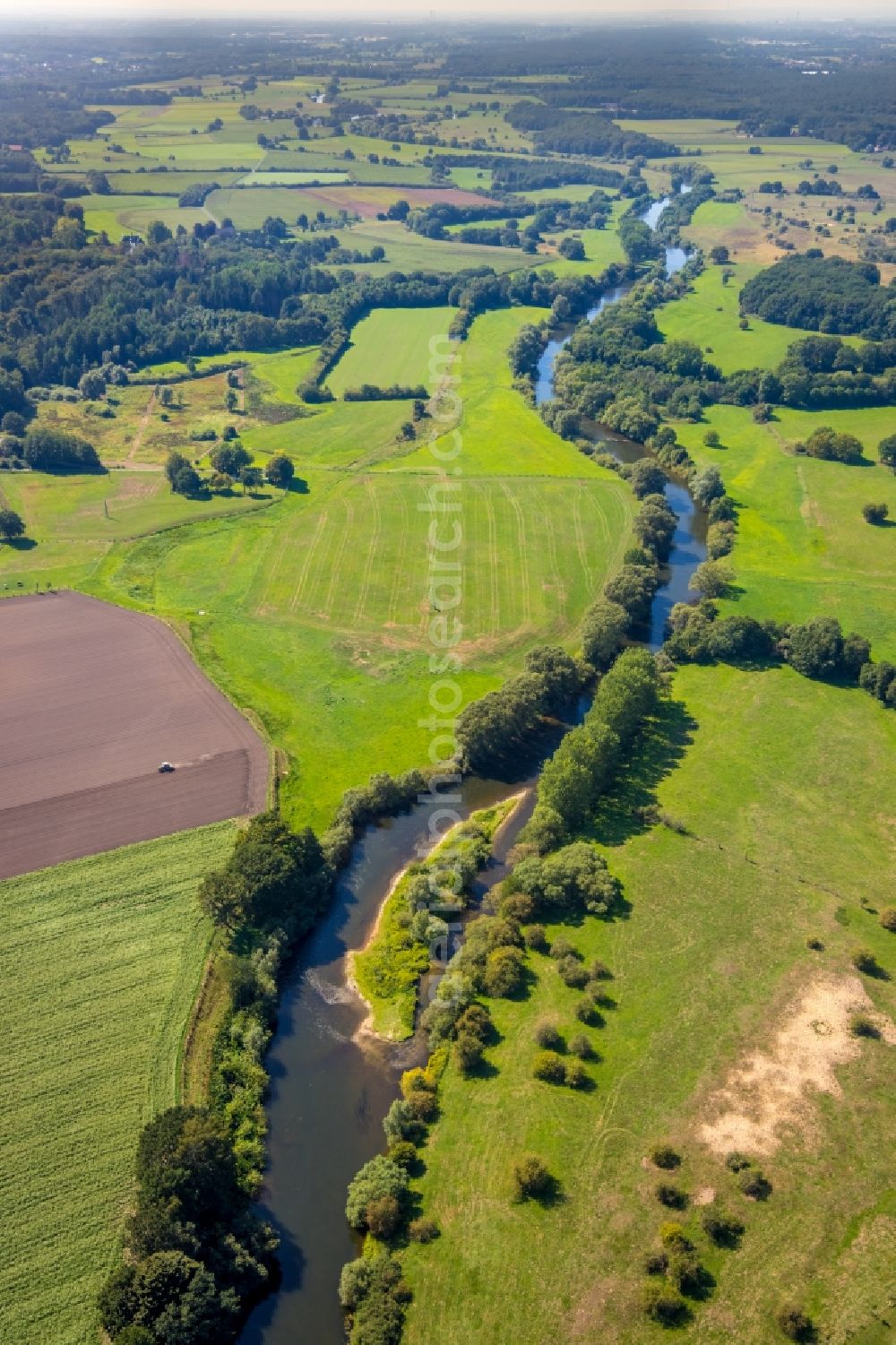 Hünxe from the bird's eye view: Curved loop of the riparian zones on the course of the river Lippe in Huenxe in the state North Rhine-Westphalia, Germany