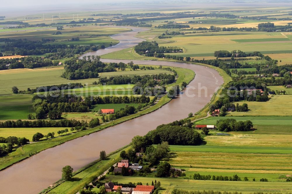 Neuhaus (Oste) from above - Curved loop of the riparian zones on the course of the river Neuhaus Buelkauer Kanal in Neuhaus (Oste) in the state Lower Saxony, Germany