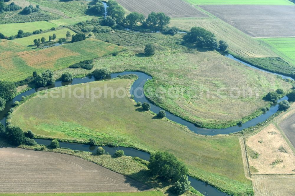 Meinersen from the bird's eye view: Curved loop of the riparian zones on the course of the river Oker in Meinersen in the state Lower Saxony