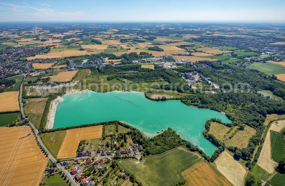 Aerial photograph Germania - Shore areas of flooded former lignite opencast mine and renaturation lake Steinbruch Anneliese on street Pionierstrasse in Germania in the state North Rhine-Westphalia, Germany