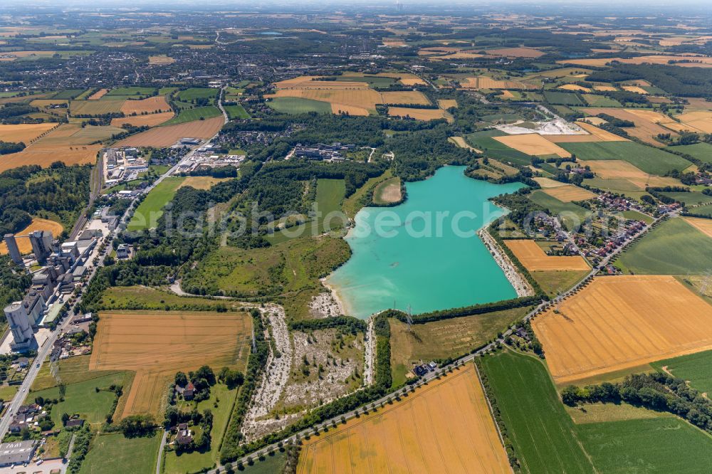 Germania from above - Shore areas of flooded former lignite opencast mine and renaturation lake Steinbruch Anneliese on street Pionierstrasse in Germania in the state North Rhine-Westphalia, Germany