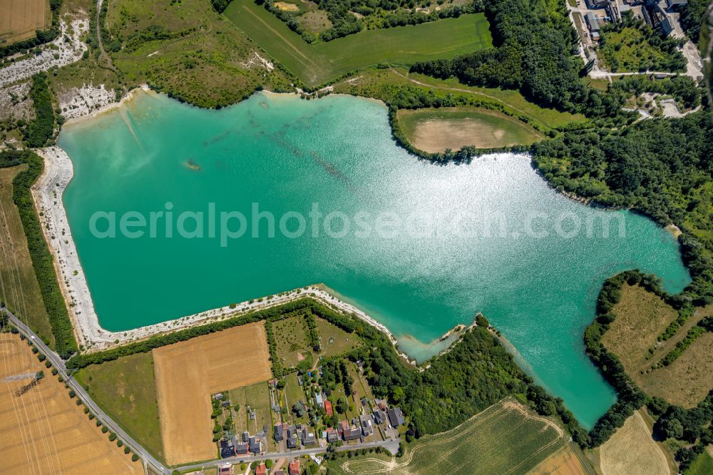 Germania from the bird's eye view: Shore areas of flooded former lignite opencast mine and renaturation lake Steinbruch Anneliese on street Pionierstrasse in Germania in the state North Rhine-Westphalia, Germany