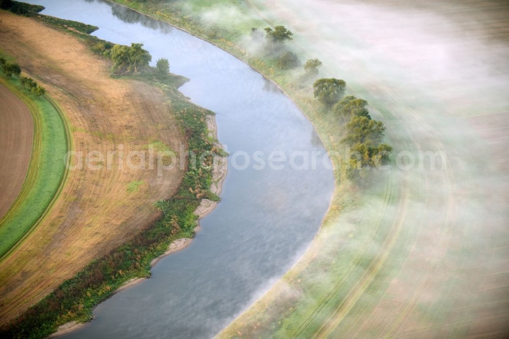 Aerial photograph Groß Rosenburg - Fog swirling over a meadow and field landscape on curved loop of the riparian zones on the course of the river of Saale in Gross Rosenburg in the state Saxony-Anhalt, Germany