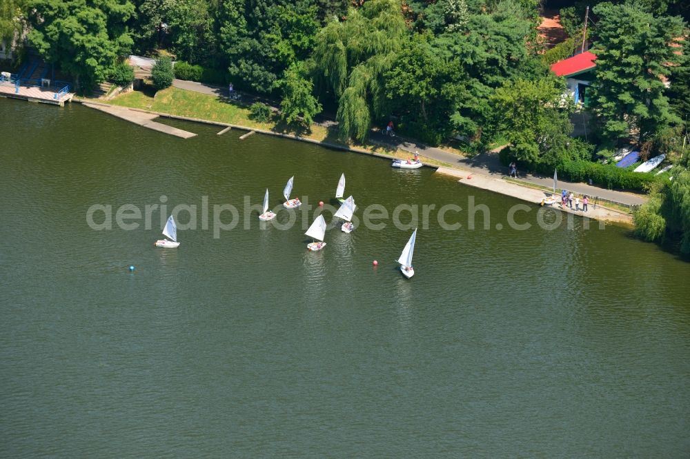 Aerial image Bukarest - Riparian areas on the lake Lacul Herastrau to the parks of the island Insula Trandafinlor in Bucharest, Romania