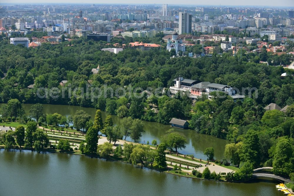 Aerial image Bukarest - Riparian areas on the lake Lacul Herastrau to the parks of the island Insula Trandafinlor in Bucharest, Romania