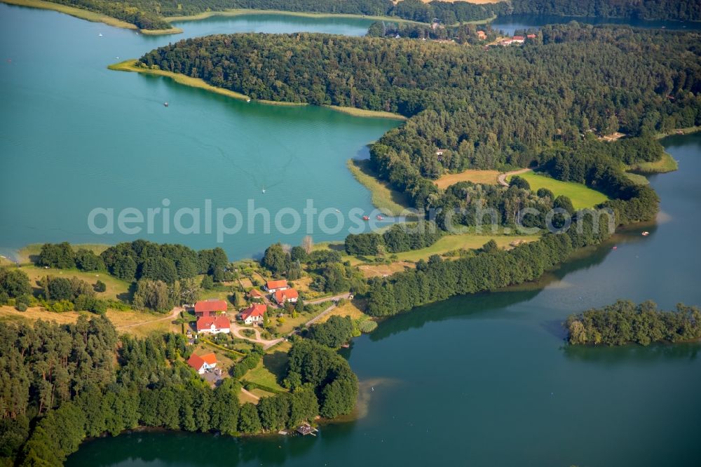 Feldberger Seenlandschaft from the bird's eye view: Riparian areas on the lake area of Houselake and Breiter Luzin with detached houses and forest in the Feldberger Seenlandschaft in the state Mecklenburg - Western Pomerania