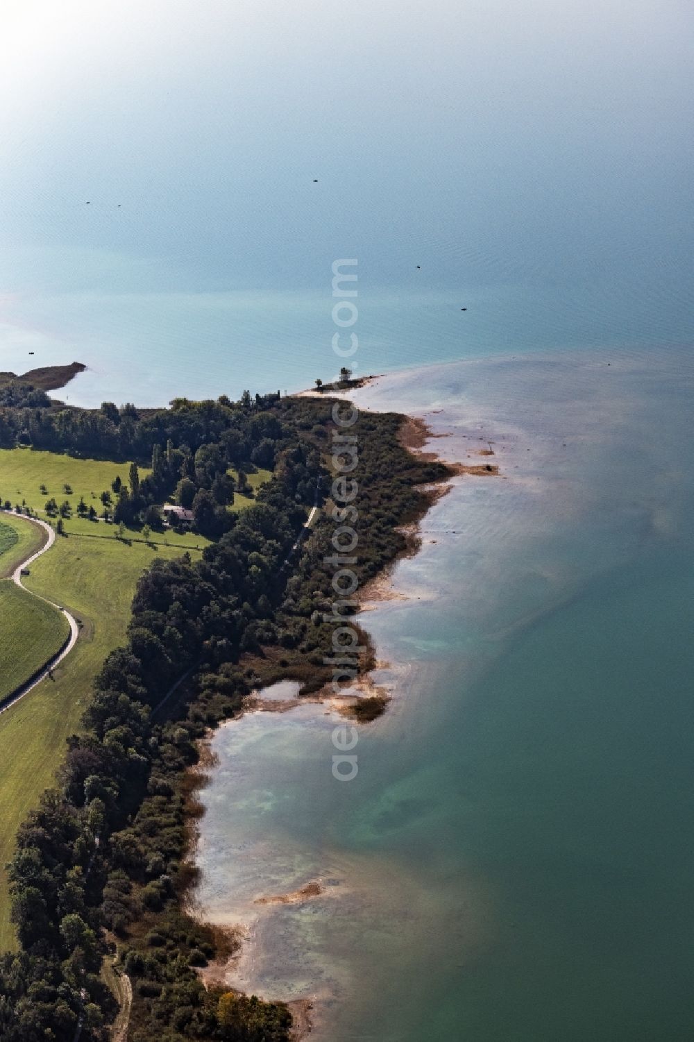 Chieming from above - Riparian areas on the lake area of Chiemsee in Chieming in the state Bavaria, Germany