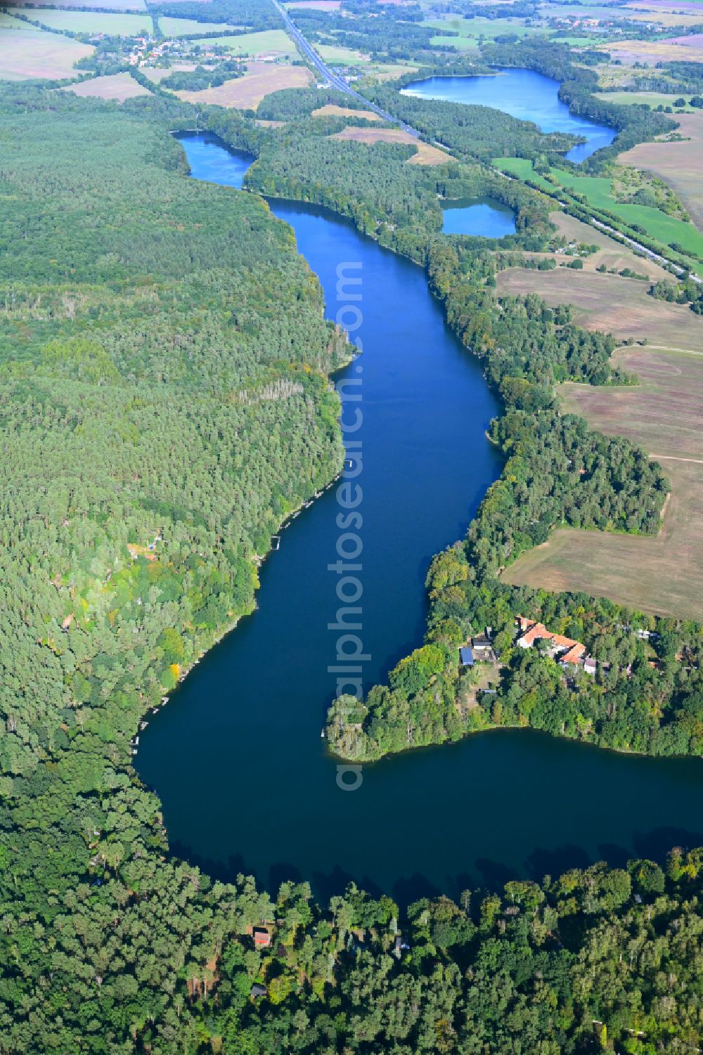 Werbellin from the bird's eye view: Riparian areas on the lake area of Uedersee in a forest area in Werbellin at Schorfheide in the state Brandenburg, Germany