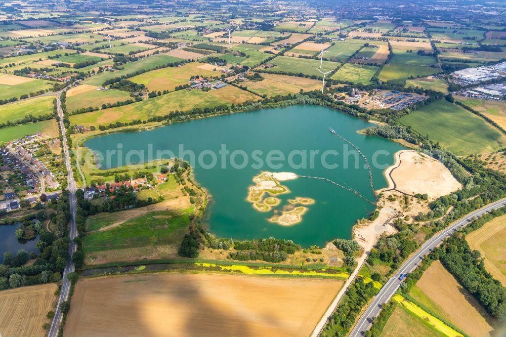 Isselburg from above - Riparian areas on the lake area of - Grabungsteich with Sandduenen- Insel in Isselburg in the state North Rhine-Westphalia, Germany