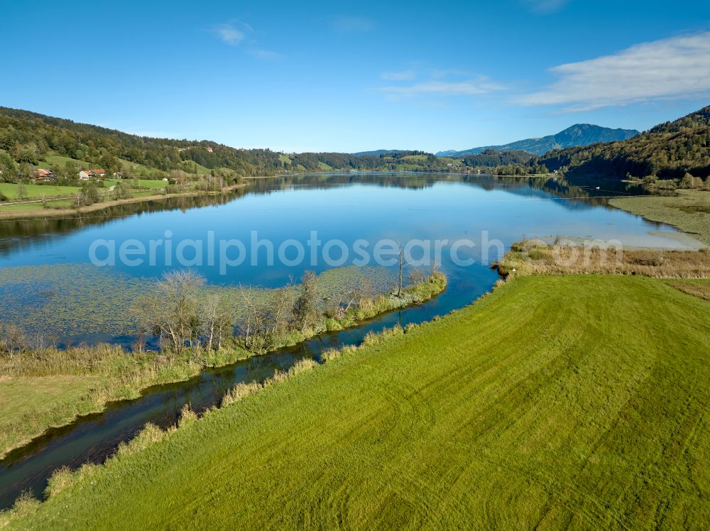 Aerial image Immenstadt im Allgäu - Shore areas at the lake area of Grosser Alpsee in the valley of the mountain landscape in Immenstadt im Allgaeu in the state Bavaria, Germany