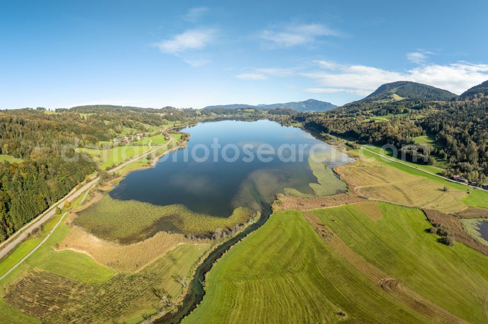 Aerial image Immenstadt im Allgäu - Shore areas at the lake area of Grosser Alpsee in the valley of the mountain landscape in Immenstadt im Allgaeu in the state Bavaria, Germany