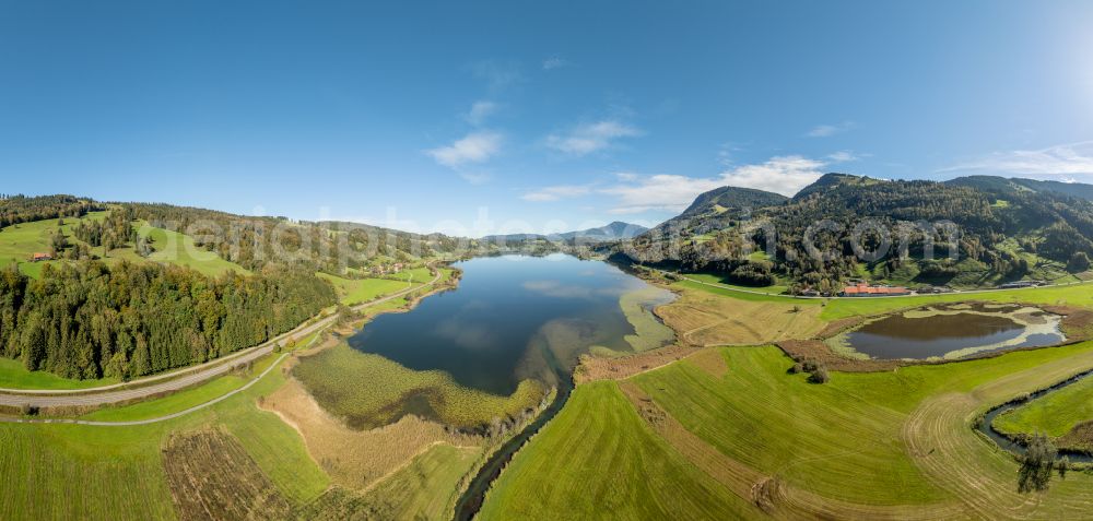 Aerial photograph Immenstadt im Allgäu - Shore areas at the lake area of Grosser Alpsee in the valley of the mountain landscape in Immenstadt im Allgaeu in the state Bavaria, Germany