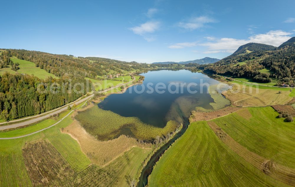 Immenstadt im Allgäu from above - Shore areas at the lake area of Grosser Alpsee in the valley of the mountain landscape in Immenstadt im Allgaeu in the state Bavaria, Germany