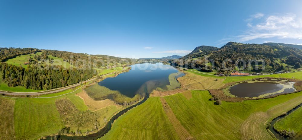 Aerial photograph Immenstadt im Allgäu - Shore areas at the lake area of Grosser Alpsee in the valley of the mountain landscape in Immenstadt im Allgaeu in the state Bavaria, Germany