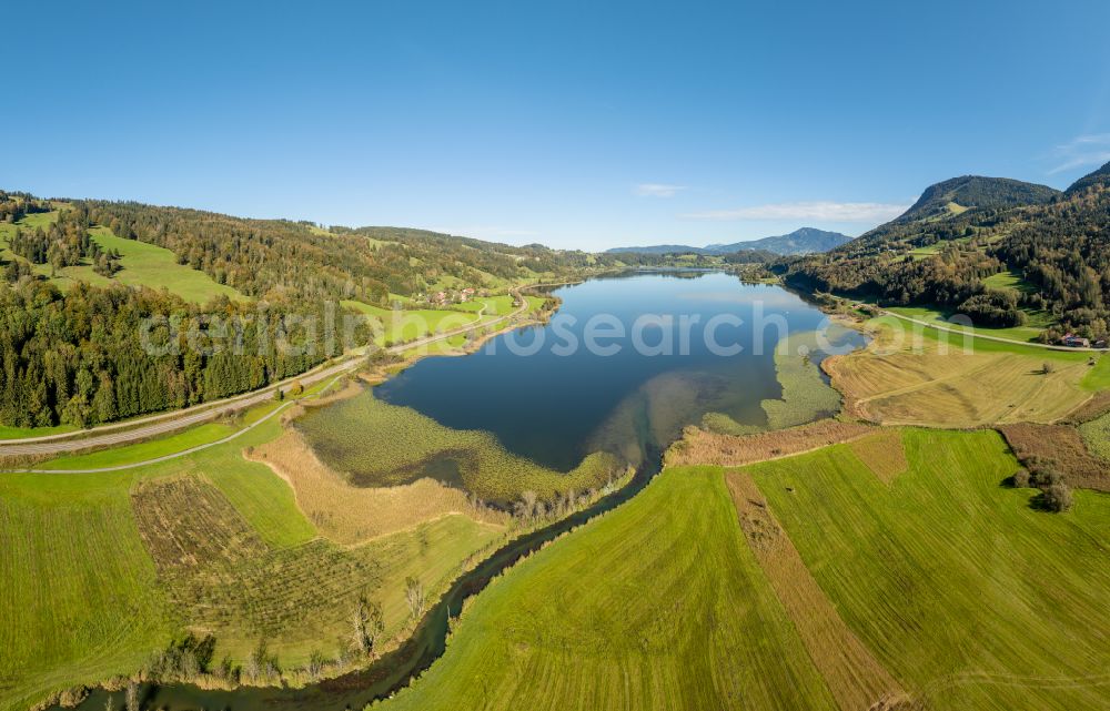 Immenstadt im Allgäu from above - Shore areas at the lake area of Grosser Alpsee in the valley of the mountain landscape in Immenstadt im Allgaeu in the state Bavaria, Germany