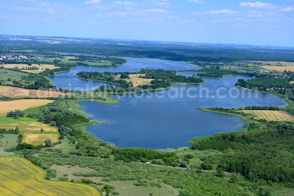 Gutow from the bird's eye view: Riparian areas on the lake area of Gutower Moor and Inselsee with Schoeninsel in Gutow in the state Mecklenburg - Western Pomerania, Germany