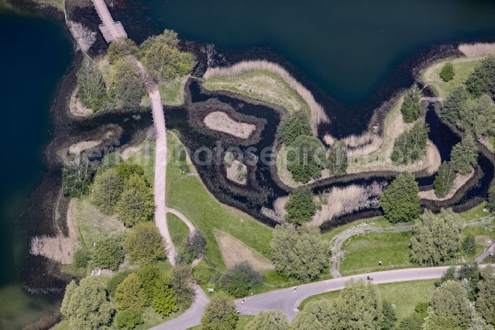 Aerial image Berlin - Riparian areas on the lake area of Hauptsee in the recreation park Britz Garden in Berlin, Germany