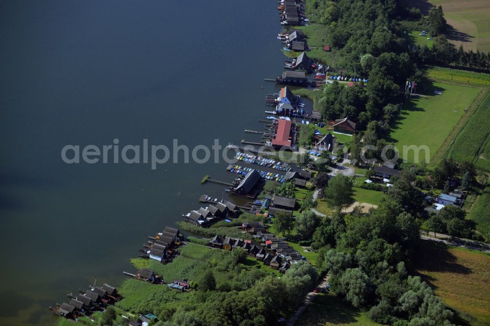 Güstrow from above - Riparian areas on the lake area of the Inselsee with piers in Guestrow in the state Mecklenburg - Western Pomerania