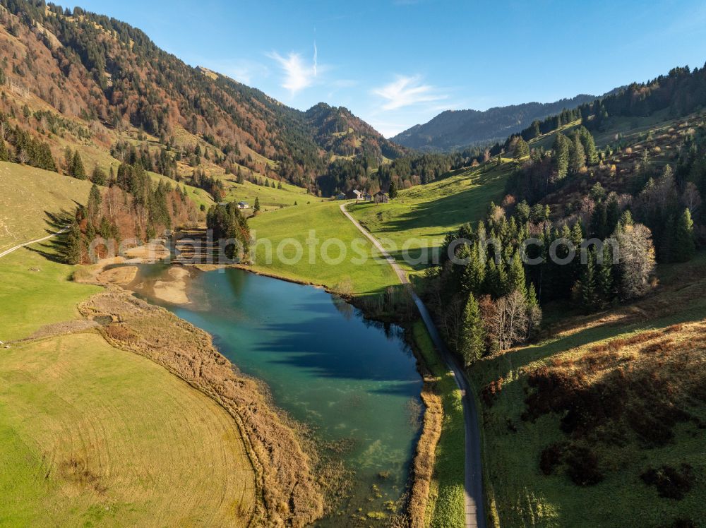 Aerial image Hochleckach - Shore areas at the lake area of Leckner See in the valley of the mountain landscape on street Hofle in Hochleckach Allgaeu in Vorarlberg, Austria