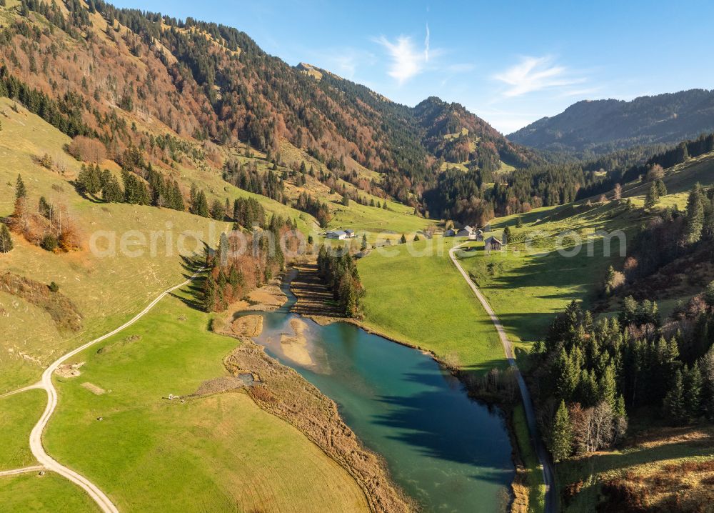 Aerial photograph Hochleckach - Shore areas at the lake area of Leckner See in the valley of the mountain landscape on street Hofle in Hochleckach Allgaeu in Vorarlberg, Austria