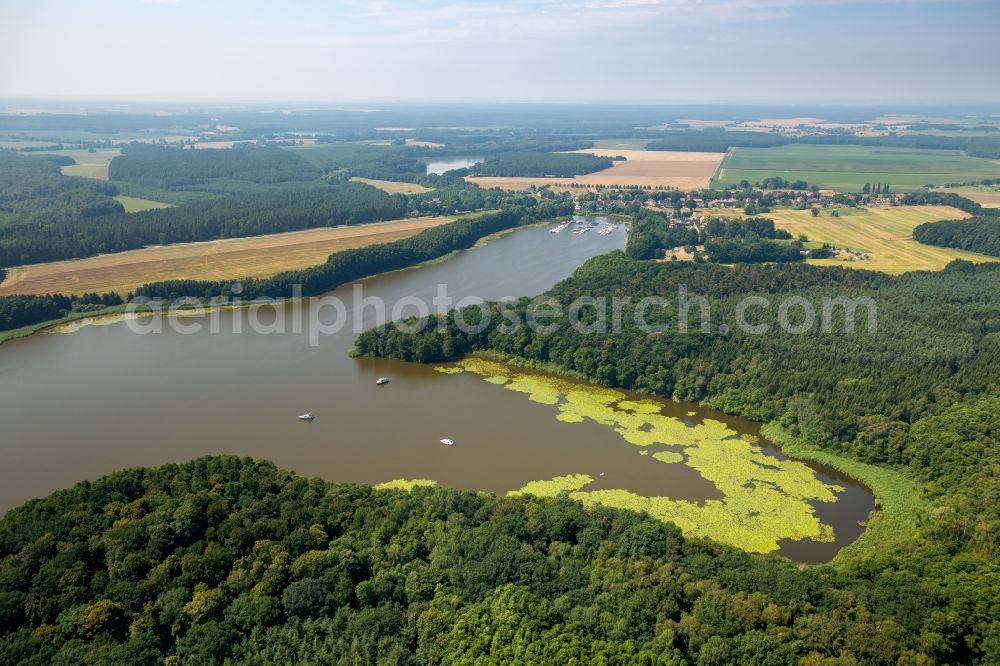 Buchholz from above - Riparian areas of lake Mueritzsee in Buchholz in the state of Mecklenburg - Western Pomerania. The lake is surrounded by forest and fields