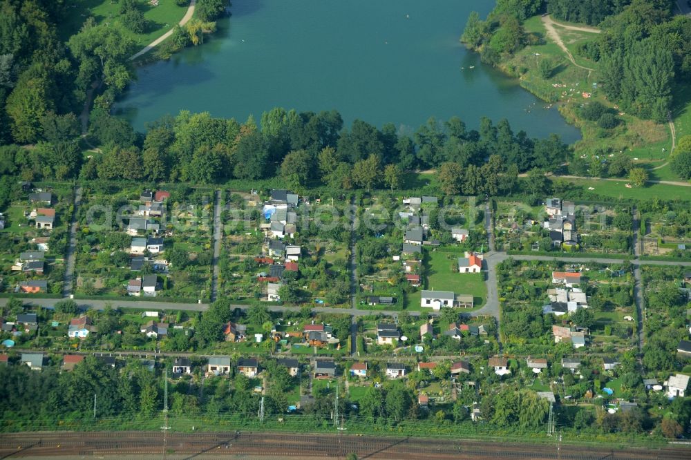 Leipzig from above - Riparian areas on the lake area of Nature bath Northeast (Bagger) in Leipzig in the state of Saxony. The lake was created through a former gravel pit and mining location