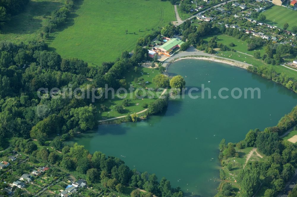 Leipzig from above - Riparian areas on the lake area of Nature bath Northeast (Bagger) in Leipzig in the state of Saxony. The lake was created through a former gravel pit and mining location