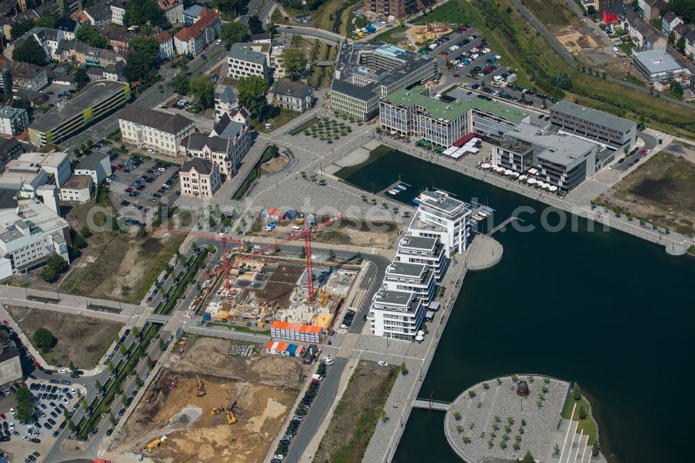 Dortmund from the bird's eye view: Riparian areas on the lake area of Phoenixsee with nearby residential areas, a port and the castle Hoerder Burg in Dortmund in the state North Rhine-Westphalia