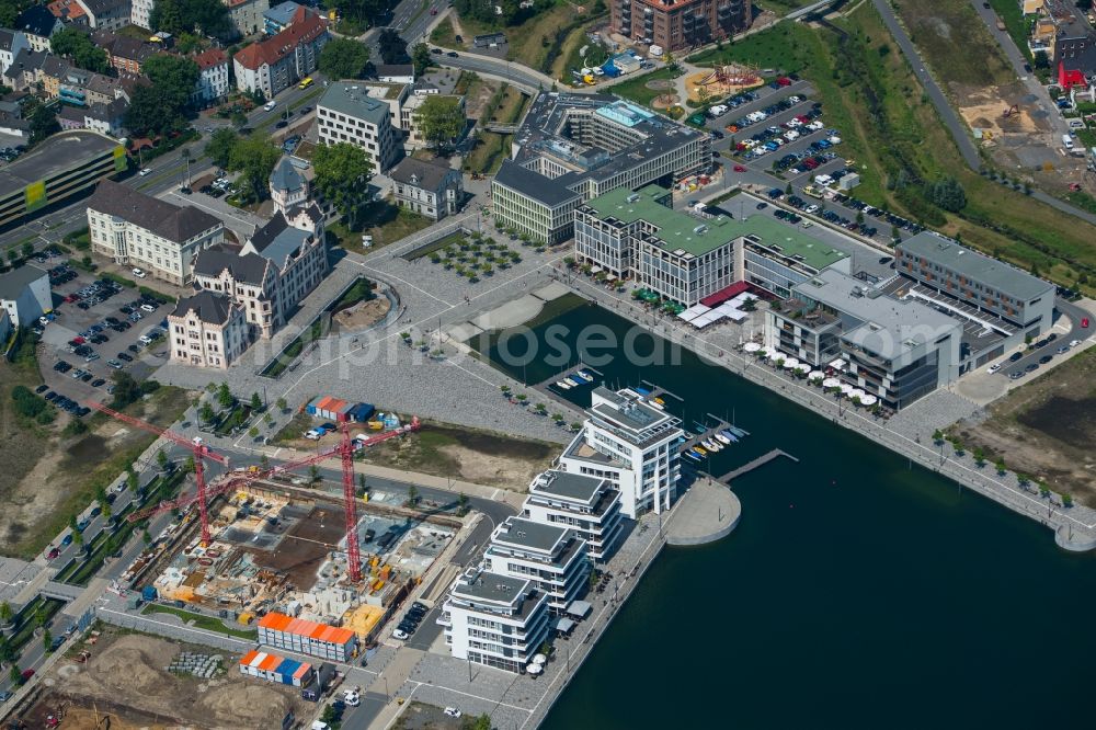 Dortmund from the bird's eye view: Riparian areas on the lake area of Phoenixsee with nearby residential areas, a port and the castle Hoerder Burg in Dortmund in the state North Rhine-Westphalia