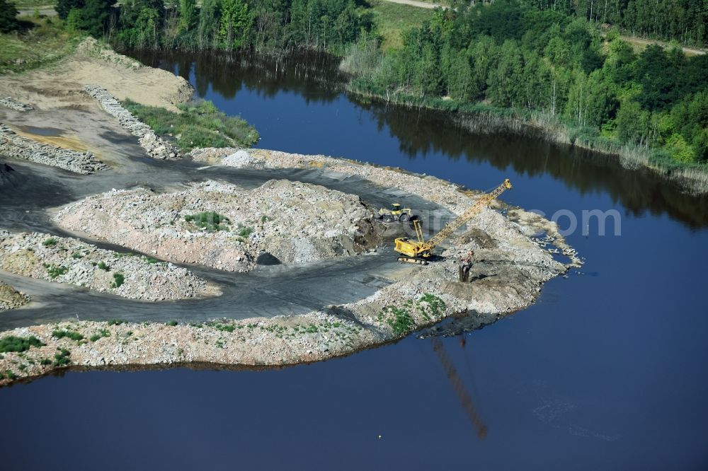 Böhlen from the bird's eye view: Riparian areas on the lake area of Wapplersee with rubble embankments and landfills in Boehlen in the state Saxony