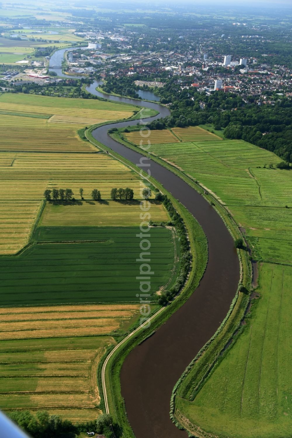 Oelixdorf from above - Curved loop of the riparian zones on the course of the river Stoer in Oelixdorf in the state Schleswig-Holstein