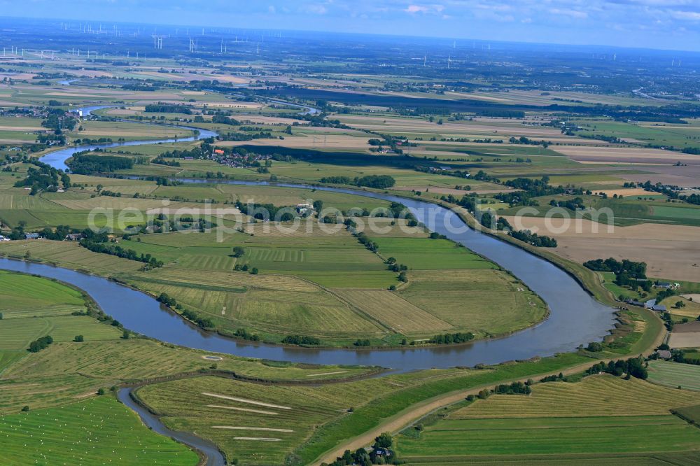 Wewelsfleth from above - Curved loop of the riparian zones on the course of the river Stoer on street Am Wischdeich in Wewelsfleth in the state Schleswig-Holstein, Germany