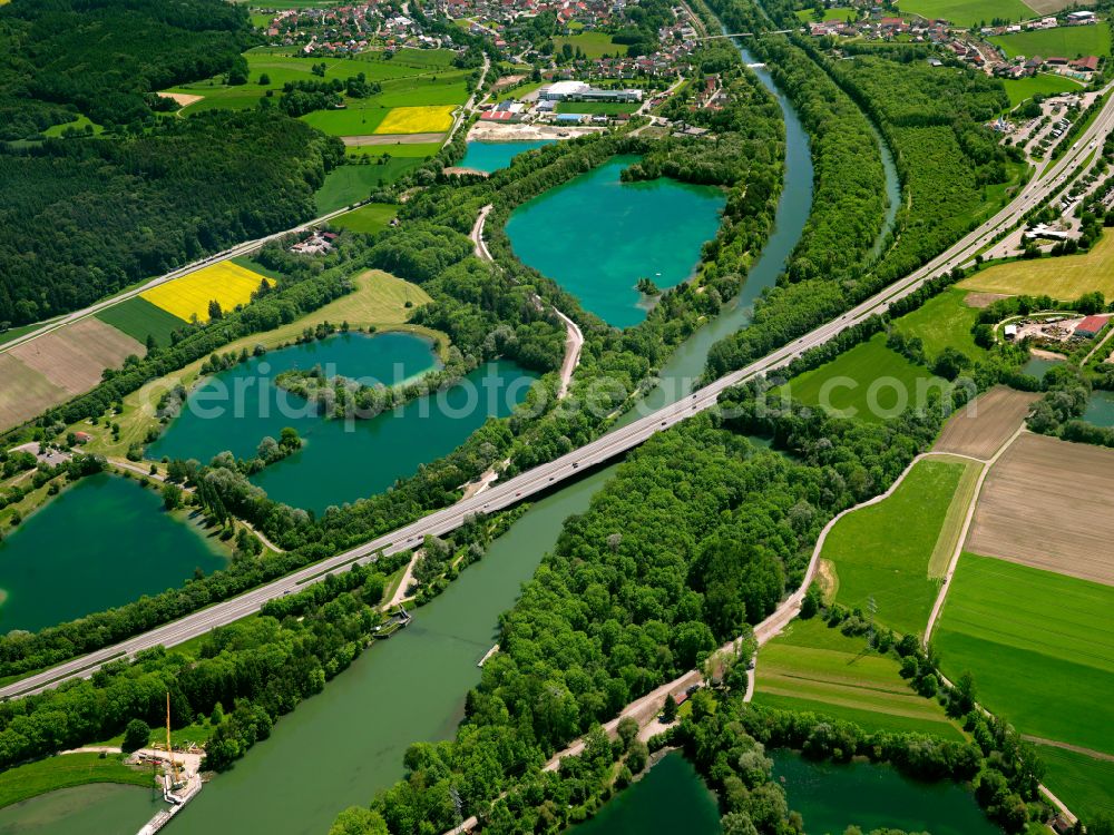 Altenstadt from the bird's eye view: Shore areas of the ponds for fish farming in Altenstadt in the state Bavaria, Germany