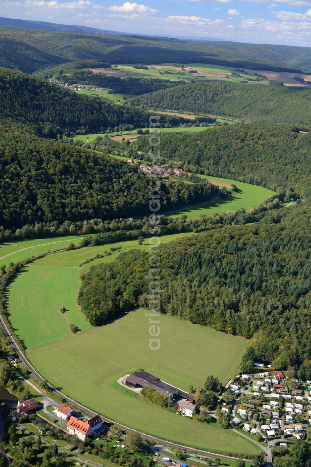 Gräfendorf from the bird's eye view: Curved loop of the riparian zones on the course of the river Fraenkische Saale in Graefendorf in the state Bavaria