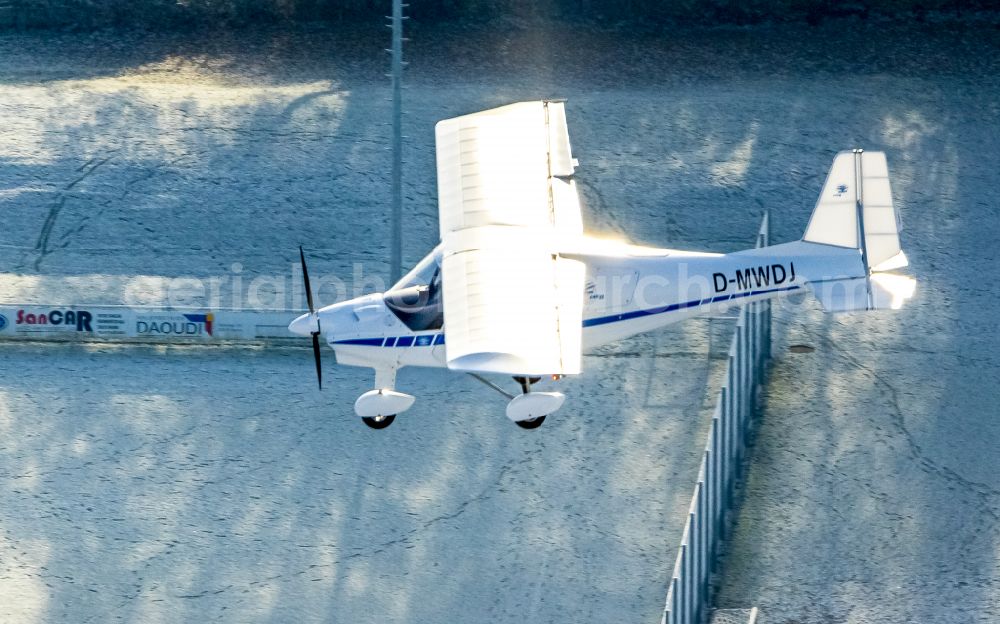 Aerial photograph Hamm - Ultralight aircraft C42 with the identifier D-MWDJ in flight above the sky in the district Heessen in Hamm at Ruhrgebiet in the state North Rhine-Westphalia, Germany