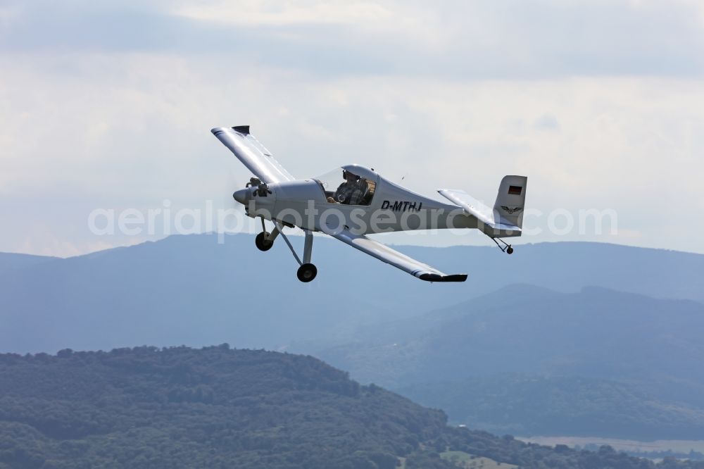 Freiburg im Breisgau from the bird's eye view: Ultralight aircraft of the 120 kilos LSA class Colomban MC-30 Luciole in flight over the airspace in Freiburg in the Breisgau in the state of Baden-Wuerttemberg