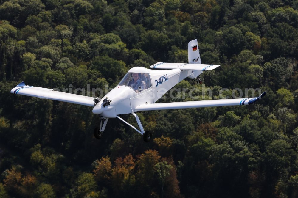 Aerial photograph Freiburg im Breisgau - Ultralight aircraft of the 120 kilos LSA class Colomban MC-30 Luciole in flight over the airspace in Freiburg in the Breisgau in the state of Baden-Wuerttemberg