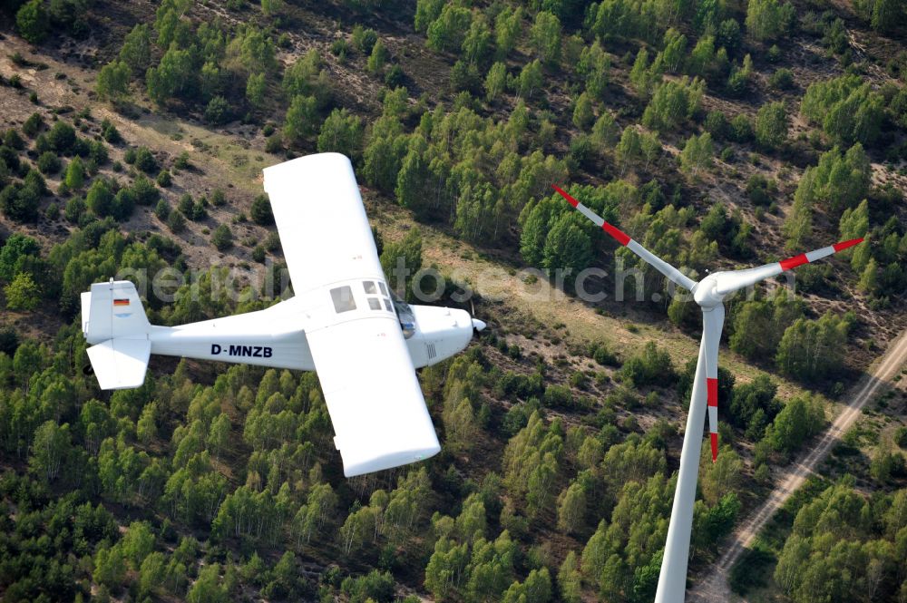 Nuthe-Urstromtal from the bird's eye view: Ultralight aircraft Wild Thing WT01 with the identifier D-MNZB in flight above the sky in Nuthe-Urstromtal in the state Brandenburg, Germany