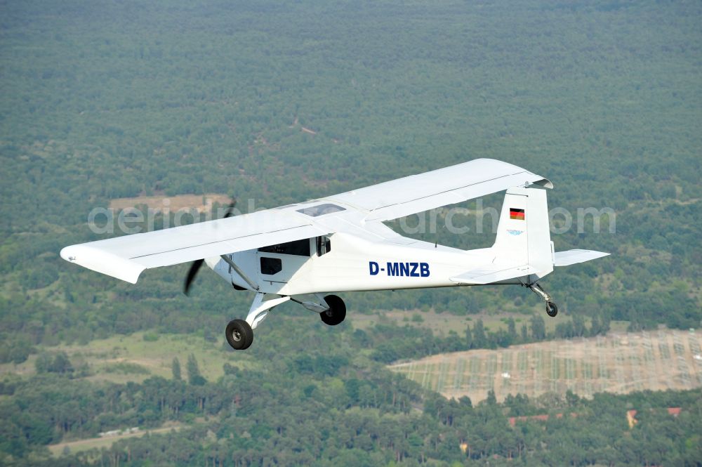 Aerial photograph Nuthe-Urstromtal - Ultralight aircraft Wild Thing WT01 with the identifier D-MNZB in flight above the sky in Nuthe-Urstromtal in the state Brandenburg, Germany