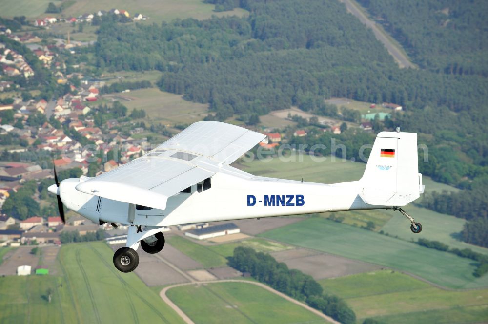 Nuthe-Urstromtal from above - Ultralight aircraft Wild Thing WT01 with the identifier D-MNZB in flight above the sky in Nuthe-Urstromtal in the state Brandenburg, Germany