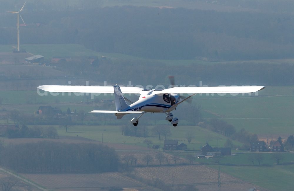 Hamm from the bird's eye view: View of an ultralight aircraft, a JK 05 Junior with the registration D-MQJK after starting on the airfield Hamm in North Rhine-Westphalia