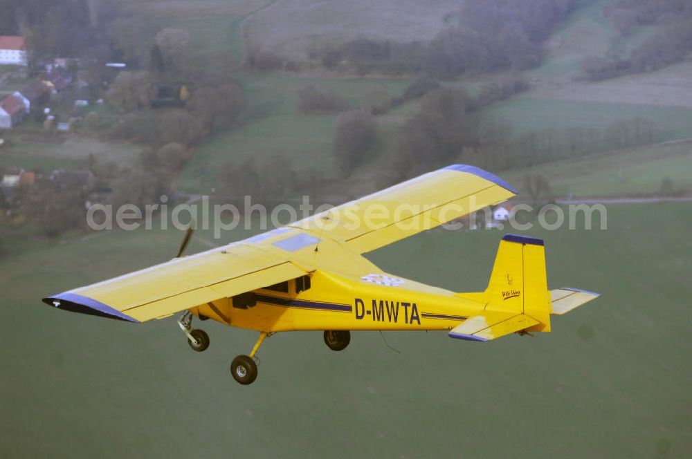 Aerial photograph STRAUSBERG - Ultraleichtflugzeug Wild Thing WT 01 der AERO LIGHT Flugschule Strausberg im Anflug auf den Flugplatz Strausberg