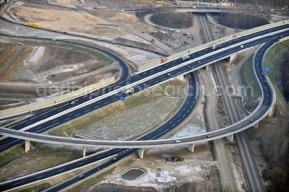 Aerial photograph Braunschweig - Blick auf den Um- und Ausbau des Autobahndreiecks Braunschweig-Südwest an der Autobahn A29 / A 391. Der EUROVIA Baukonzern errichtet hier einige Brückenneubauten. Bauherr ist die Niedersächsische Landesbehörde für Straßenbau und Verkehr. View of the implementation and expansion of the motorway junction Braunschweig-southwest along the highway A29 / A 395th The construction company built EUROVIA here are some new bridges. Owner is the Lower Saxony state authorities for road construction and transport.