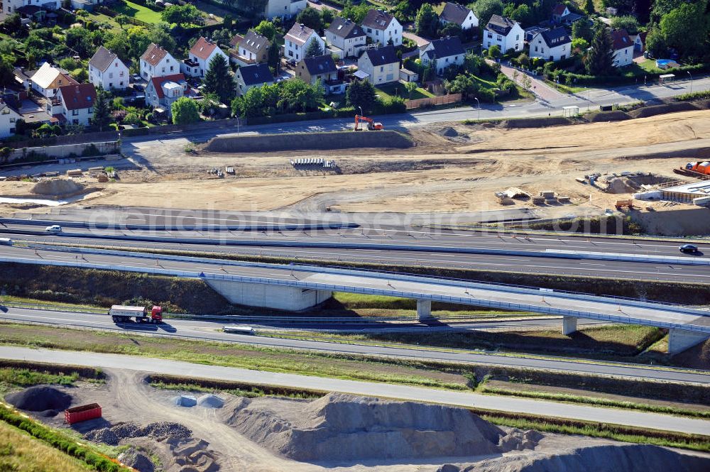 Aerial image Braunschweig - Blick auf den Um- und Ausbau des Autobahndreiecks Braunschweig-Südwest an der Autobahn A29 / A 391 in Niedersachsen. Der EUROVIA Baukonzern errichtet hier einige Brückenneubauten. Bauherr ist die Niedersächsische Landesbehörde für Straßenbau und Verkehr. View of the implementation and expansion of the motorway junction Brunswick-southwest along the freeway A29 / A 395 in Lower Saxony. The construction company EUROVIA built here are some new bridges. Owner is the Lower Saxony state authorities for road construction and transport.