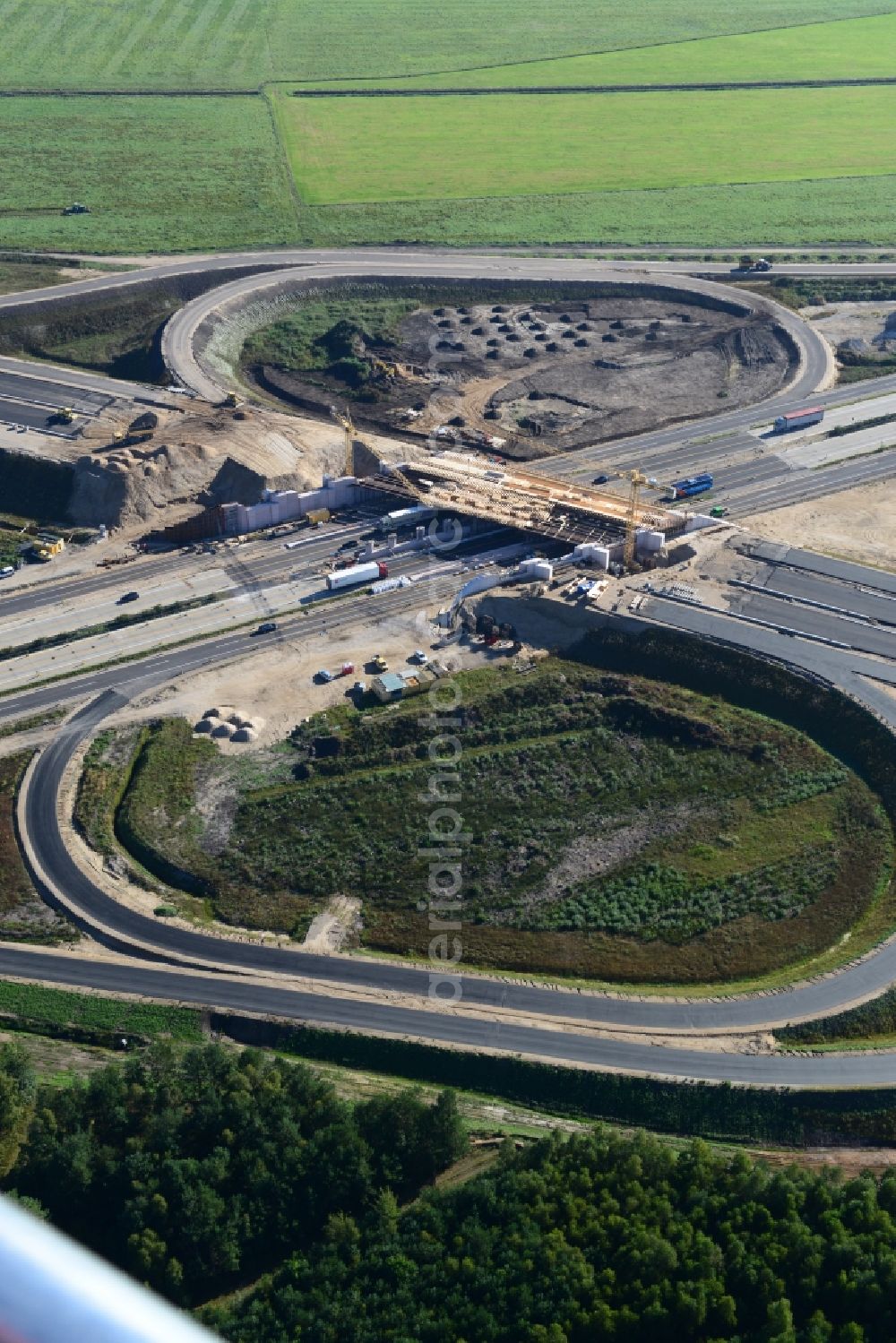 Wöbbelin from the bird's eye view: Expansion and construction site of the highway triangle Schwerin on the motorway BAB A14 and A24 at Wöbbelin in Mecklenburg - Western Pomerania